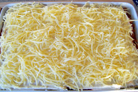 top with white sauce and grated cheese